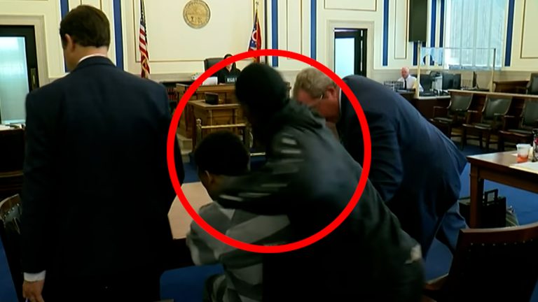 Father punches son's accused killer in Ohio court