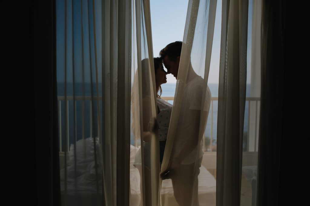 young-man-making-love-confession-his-charming-girlfriend-standing-balcony-curtains-morning-portrait-beautiful-couple-kissing-terrace-after-long-busy-day-1024x683.jpg